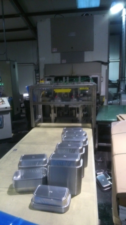 The machine is used to punch aluminium containers