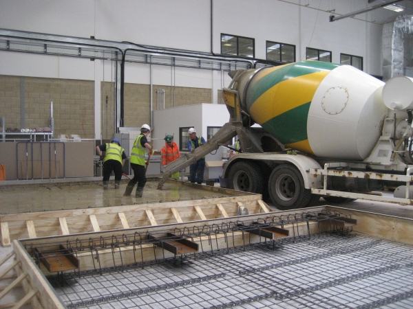 Concrete being poured into the forms
